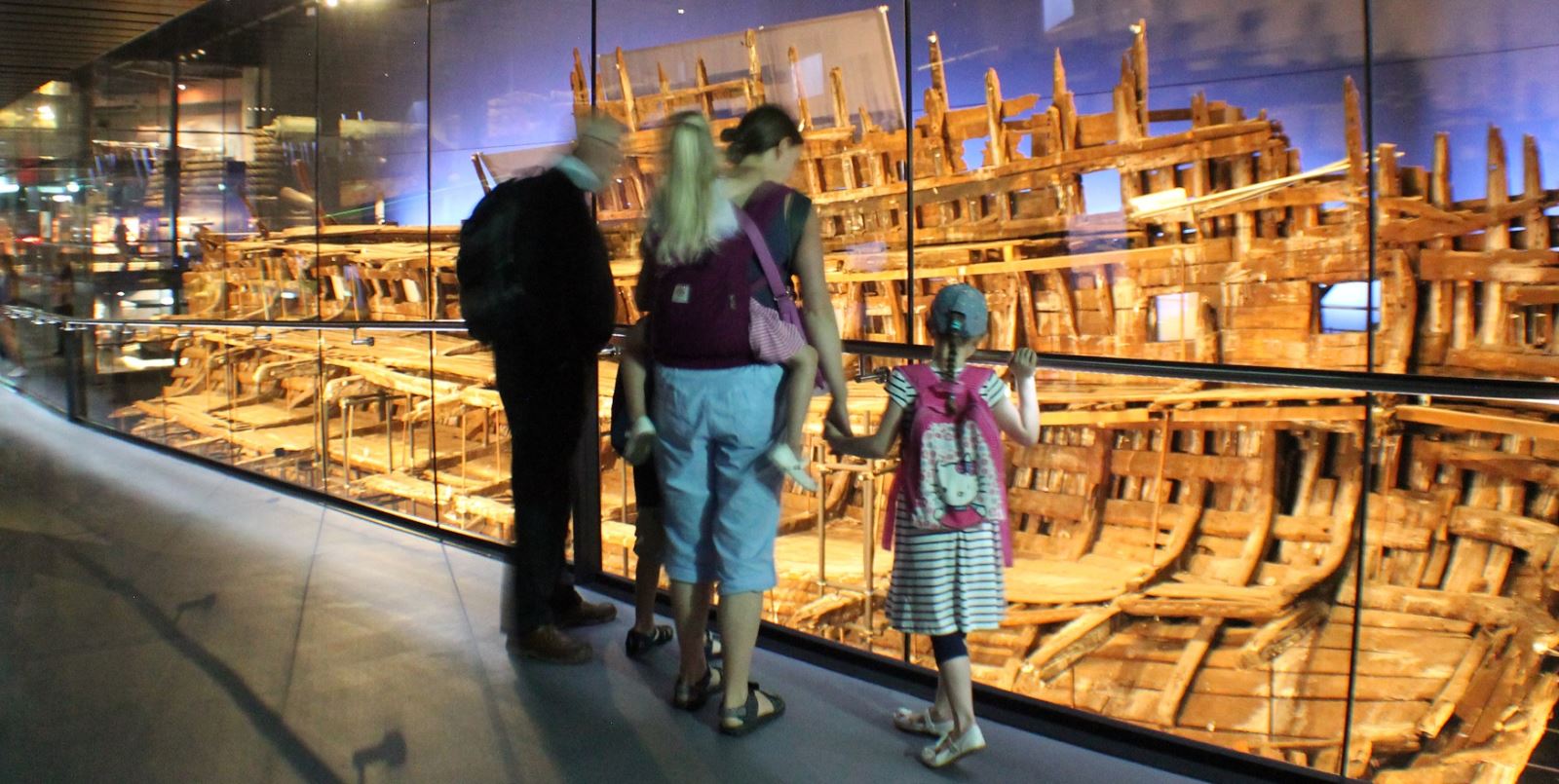 A family looks down at The Mary Rose
